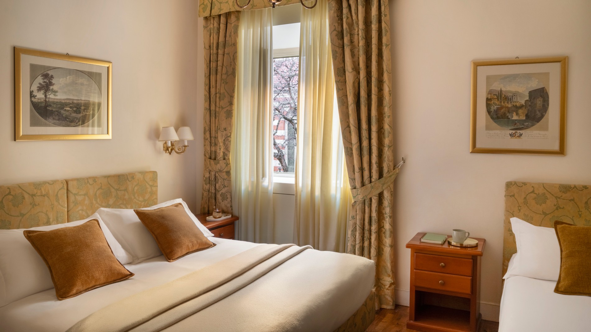Detail of a cozy guest room with a padded headboard and warm lighting in Rome. - Hotel Cortina, BZAR hotels in Rome